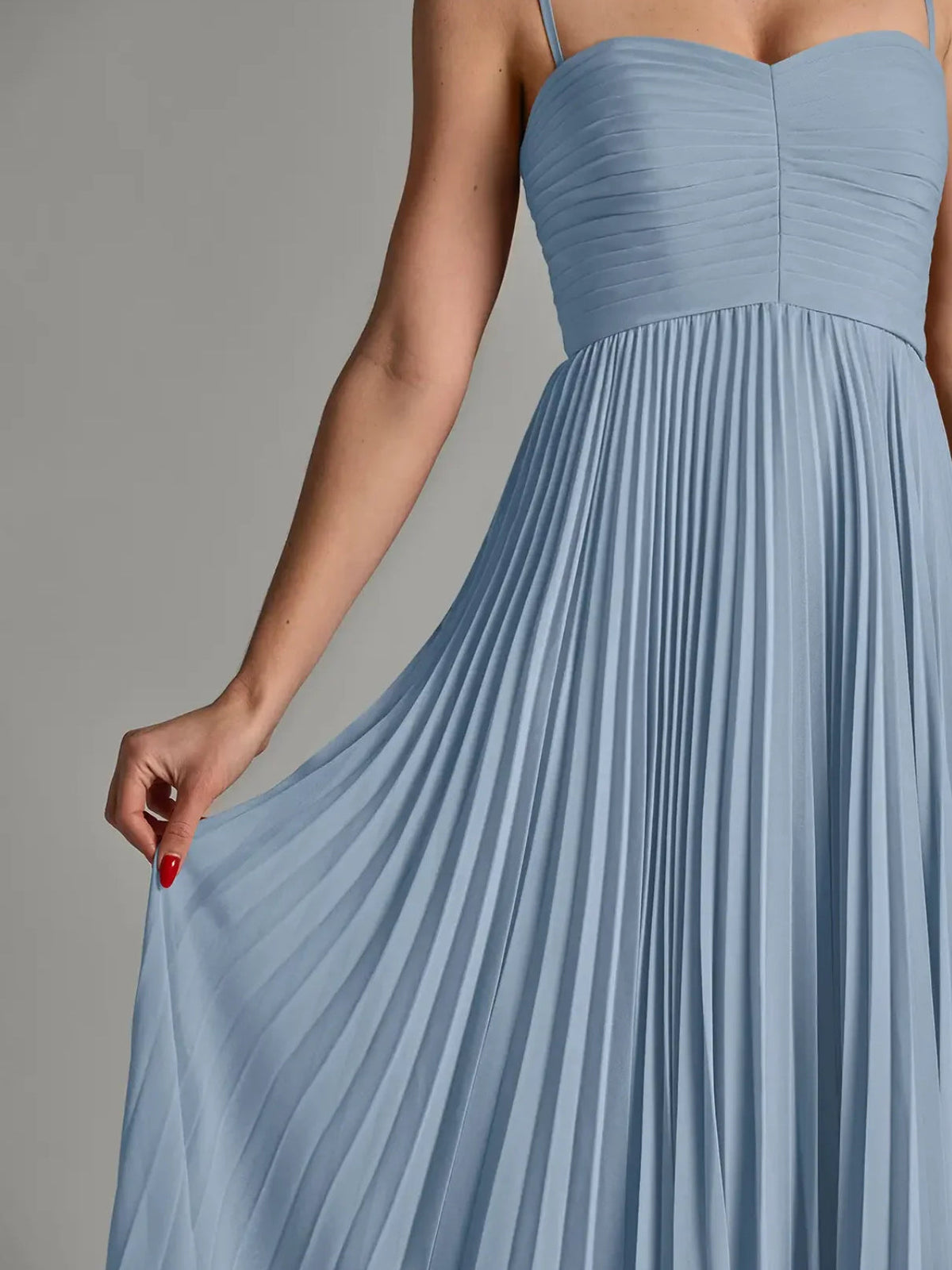 Dusty blue strapless chiffon bodice and pleated skirt, close-up