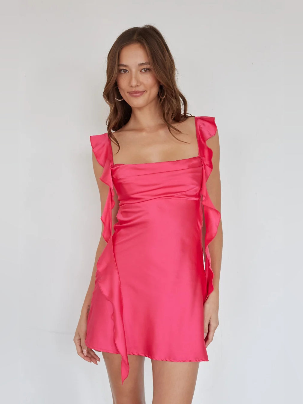 Fuchsia satin mini dress with layered ruffle sleeves and fitted waist