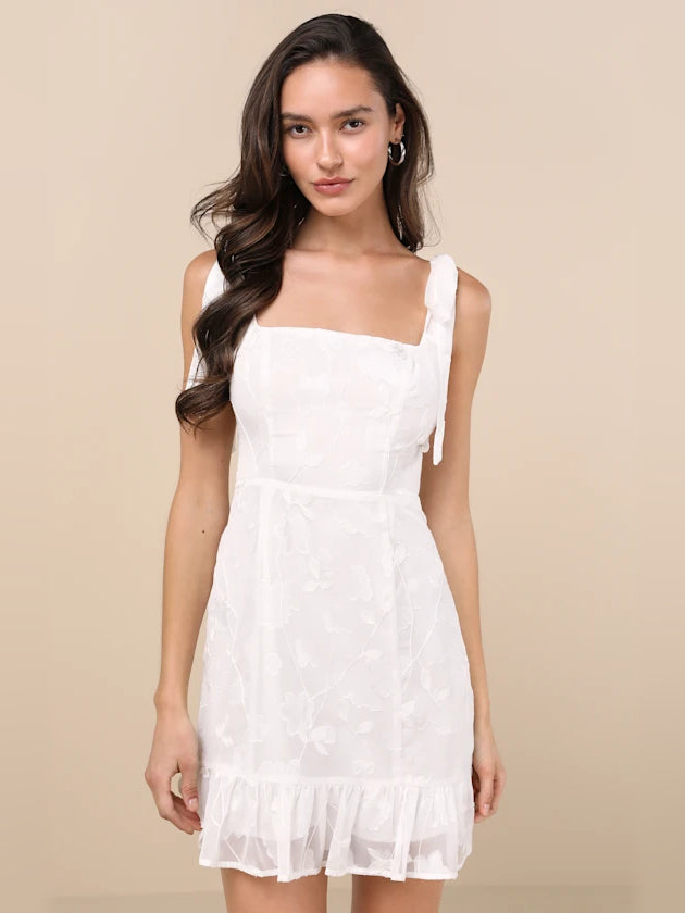 White embroidered floral mini dress, square neckline, fitted bodice, ruffled skirt