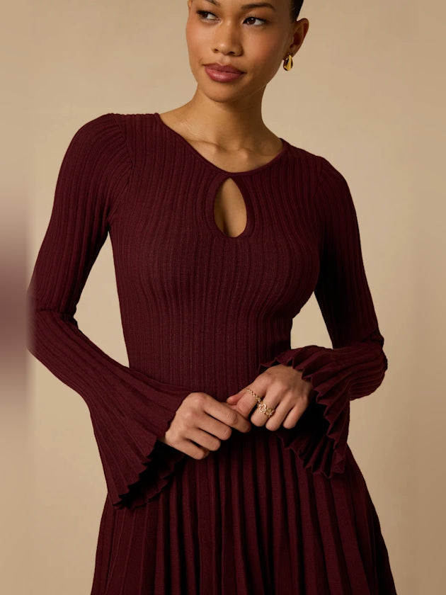 Plum ribbed knit mini dress with oval cut-out neckline and long flared sleeves