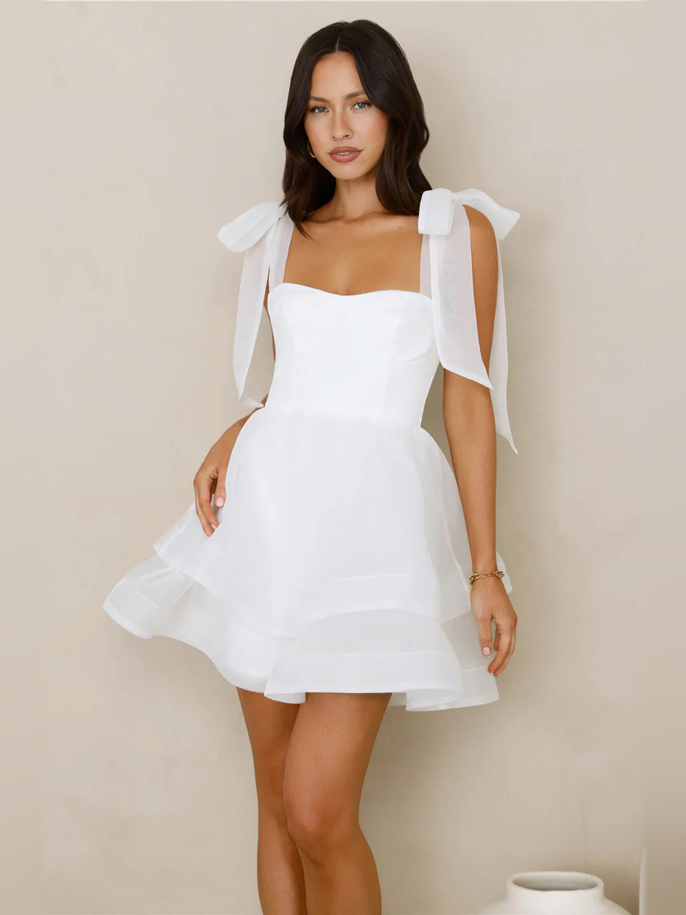 White square-neck mini dress with bow-tied shoulder straps and tiered tulle skirt
