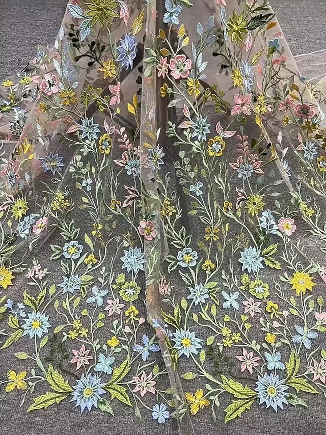 Embroidered floral pattern on sheer tulle with multicolor thread