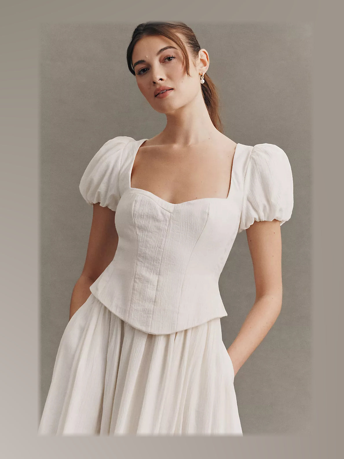 Ivory formal dress with structured woven fabric construction and maxi hem