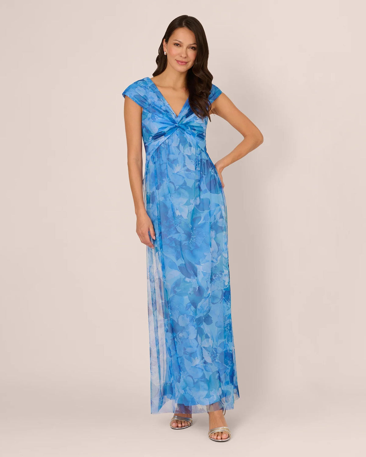 Blue floral A-line maxi dress with cap sleeves, V-neck, and twisted center detail