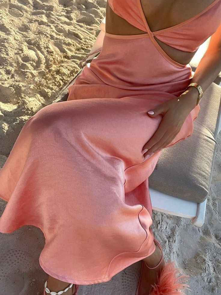 Pink satin cutout maxi dress with draped bodice and diagonal neckline detail