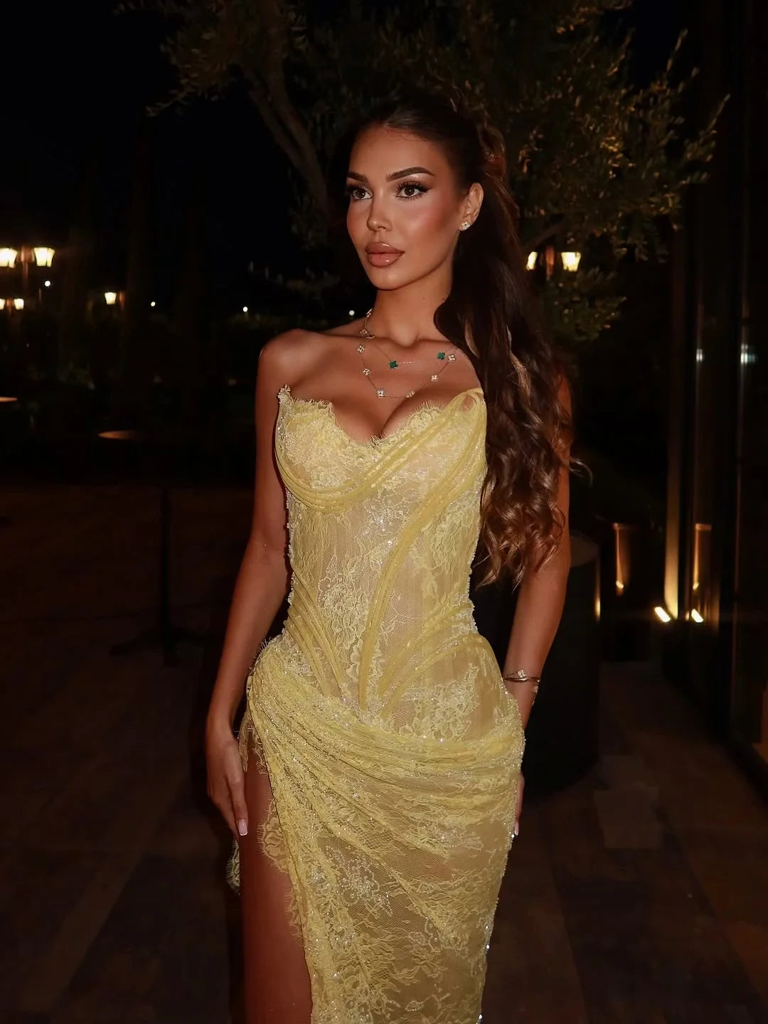 Yellow sweetheart ruched prom dress with draped bodice and lace-like texture