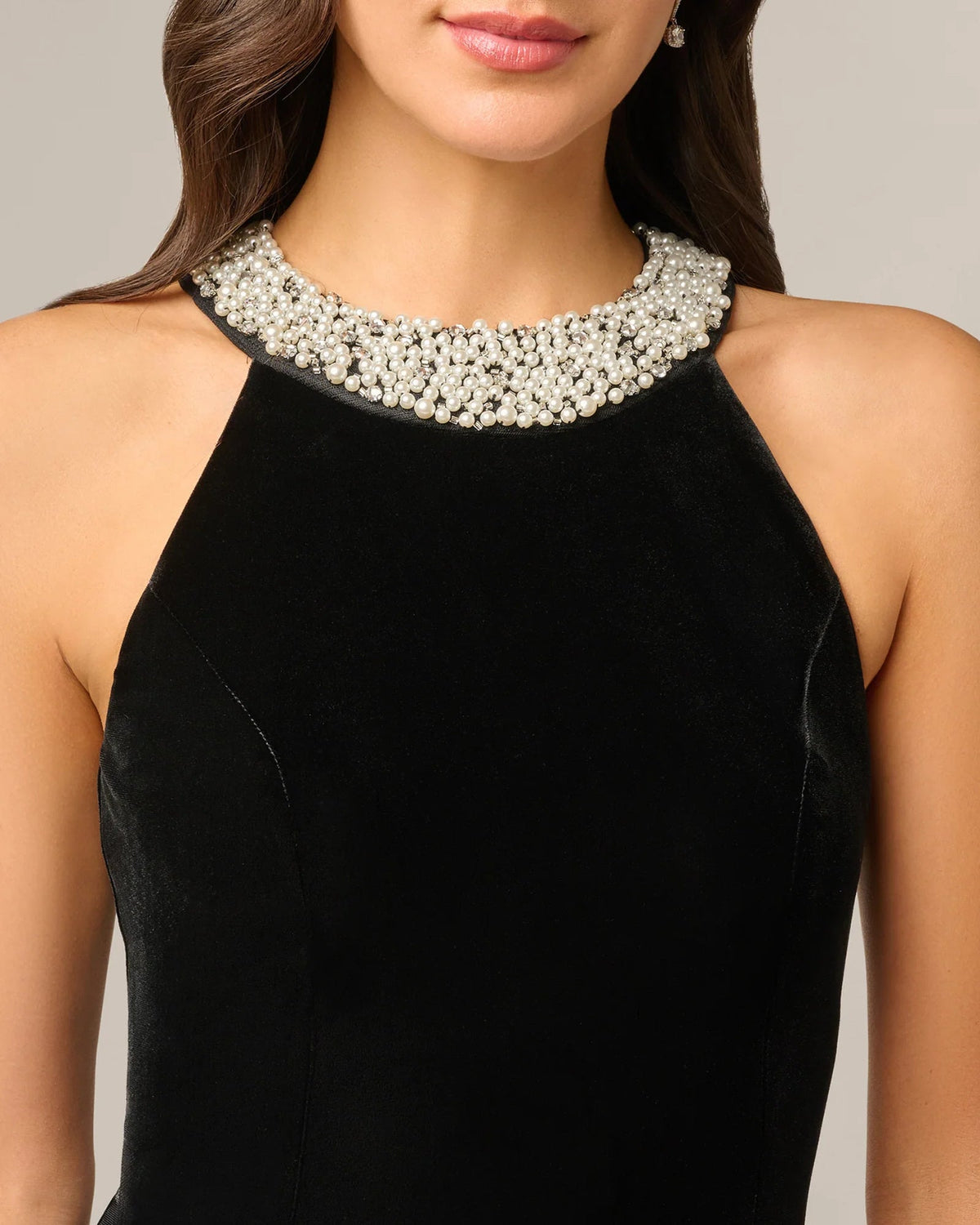 Black sleeveless halter neckline with sparkling jeweled collar and round silver-toned stones