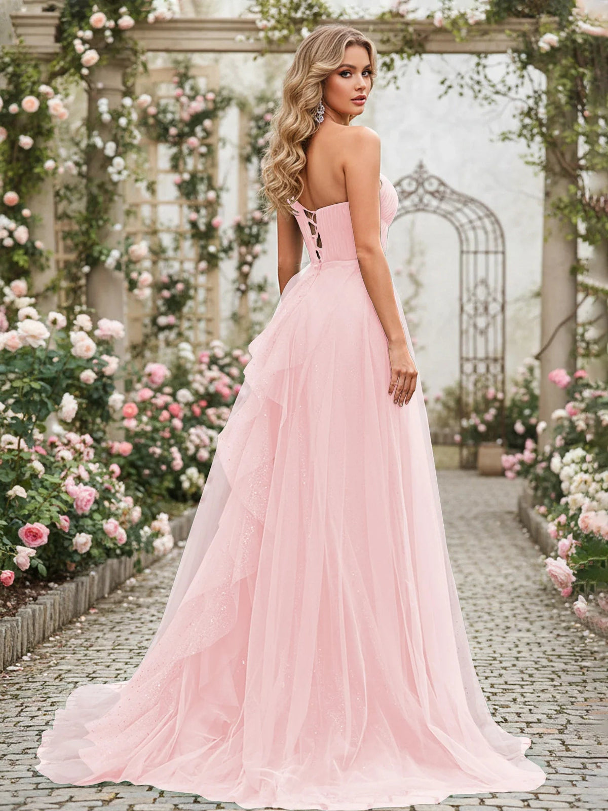 Blush pink one-shoulder corset dress with pleated tulle skirt, floor-length, open back