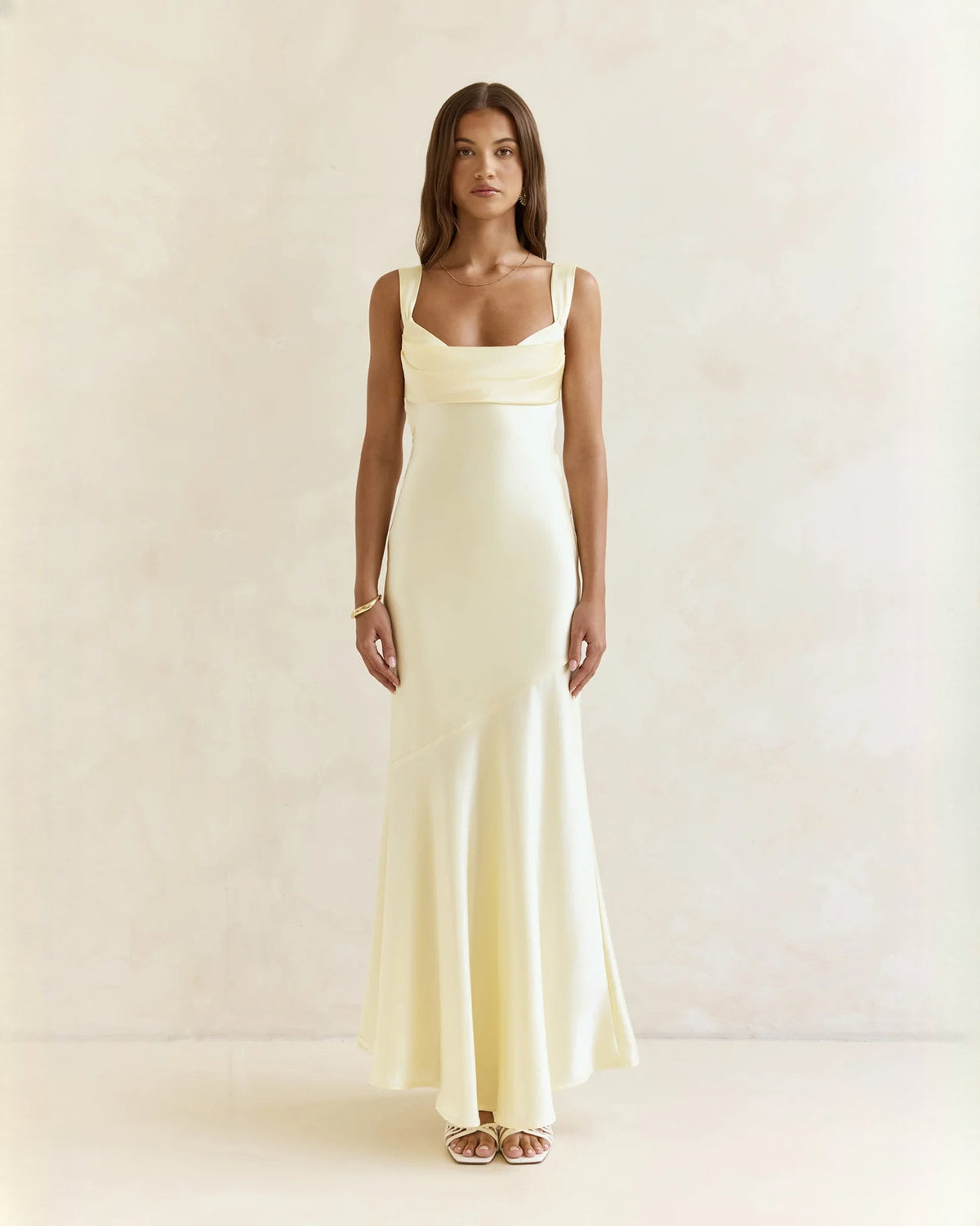Sleeveless satin A-line maxi dress in pale yellow with square neckline, front view