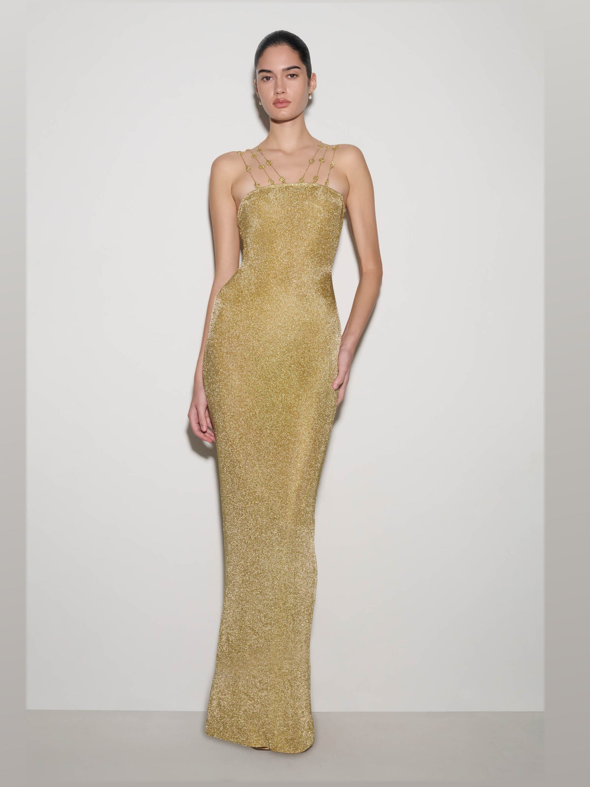 Gold formal dress with structured woven fabric construction and maxi hem