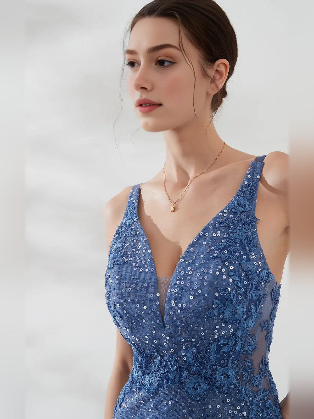 Slate blue backless mini dress with deep V neckline, corset detail, sparkling allover sequins
