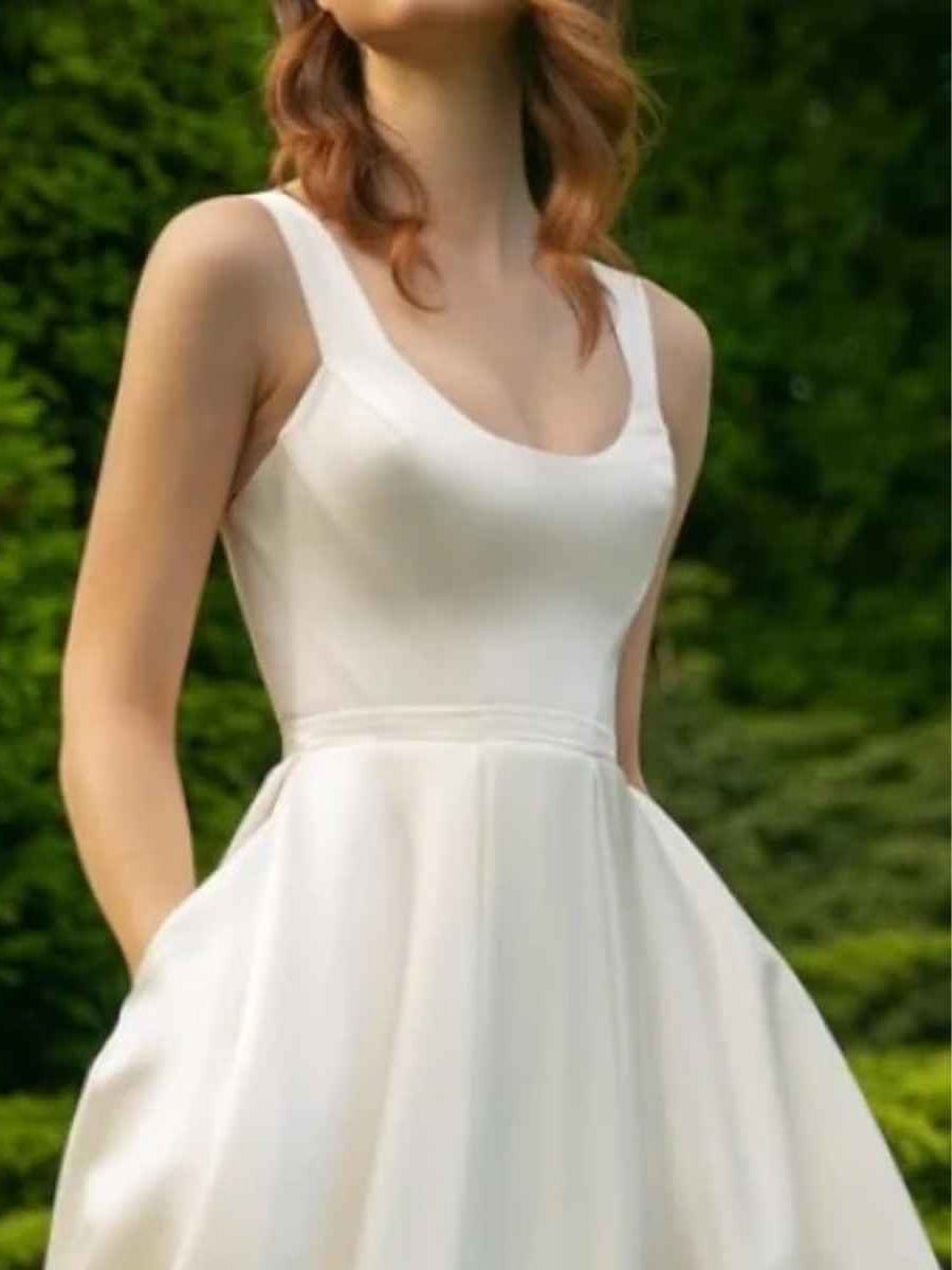 White satin A-line midi bridesmaid dress with scoop neckline and gathered waist