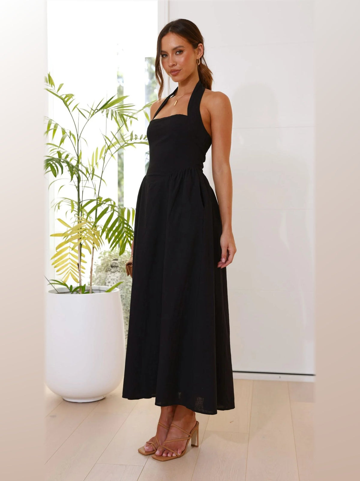 Black midi formal dress, alternate full-length view showing the waistline