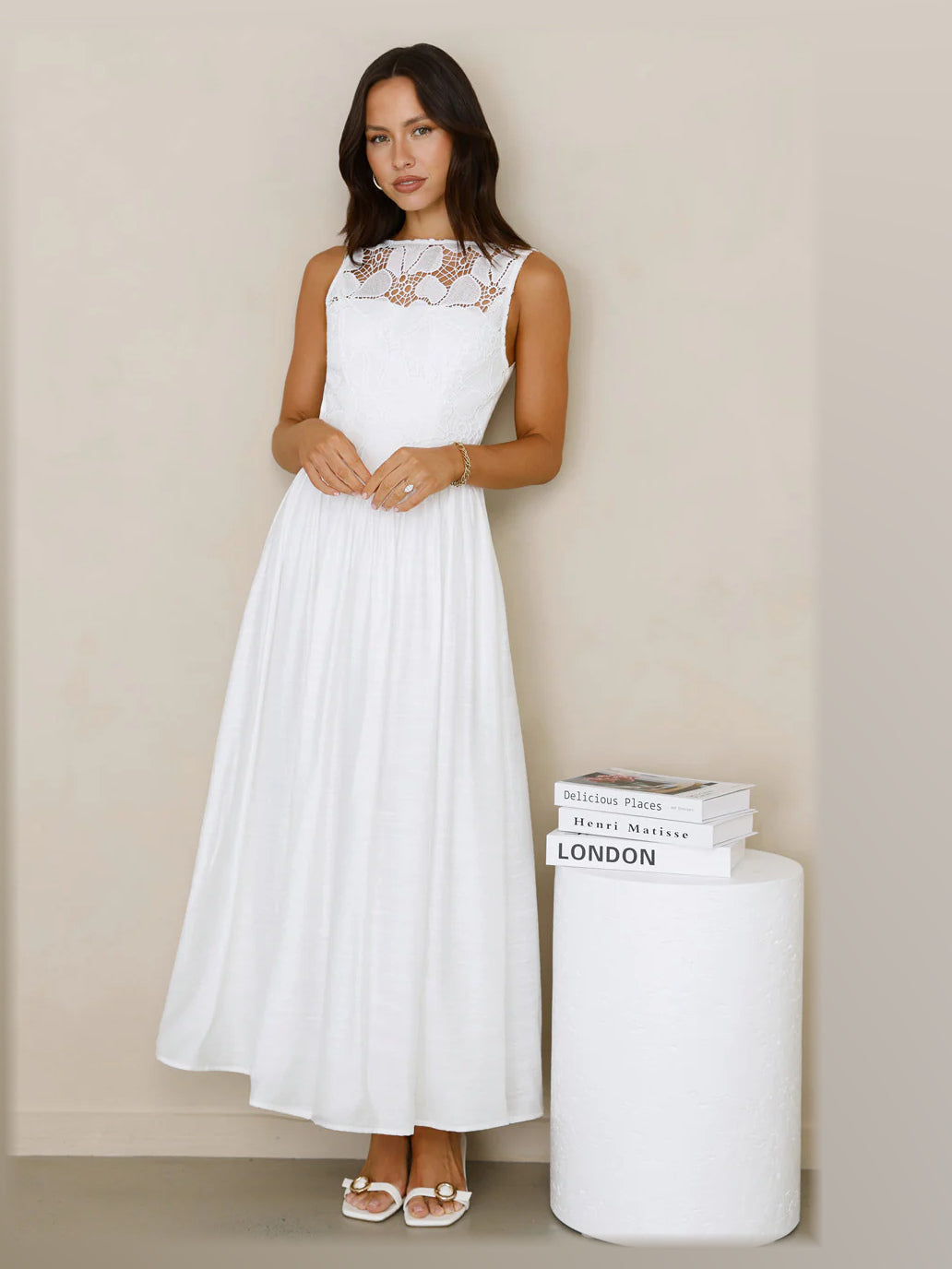 White formal dress with structured woven fabric construction and maxi hem