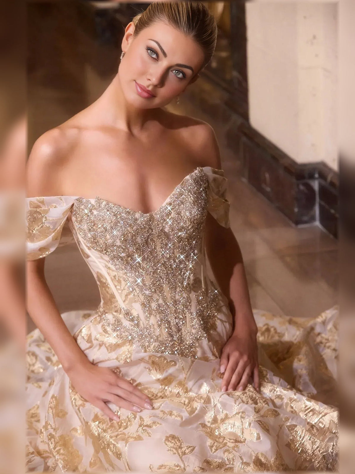 Gold sweetheart ball gown with sparkling beaded off-shoulder bodice and gathered skirt