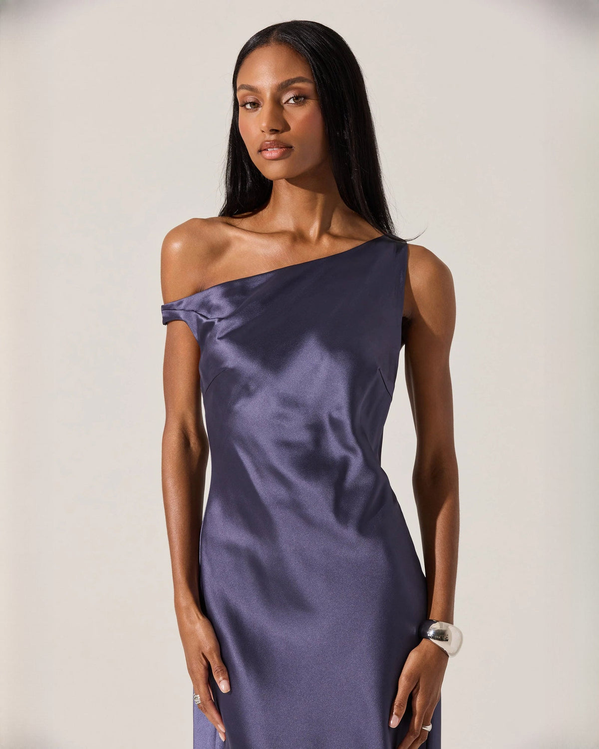 Royal blue satin off-shoulder midi dress with asymmetrical neckline and smooth sheen