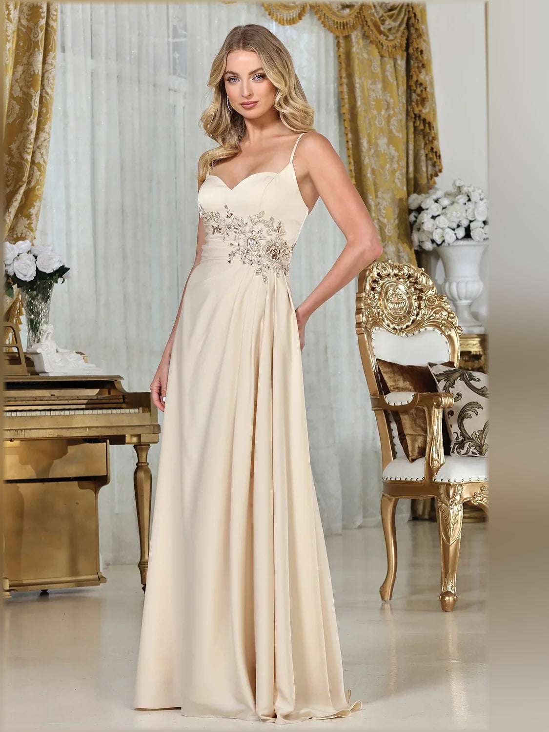 Cream spaghetti-strap formal dress with sweetheart neckline, beaded waist, flowing skirt