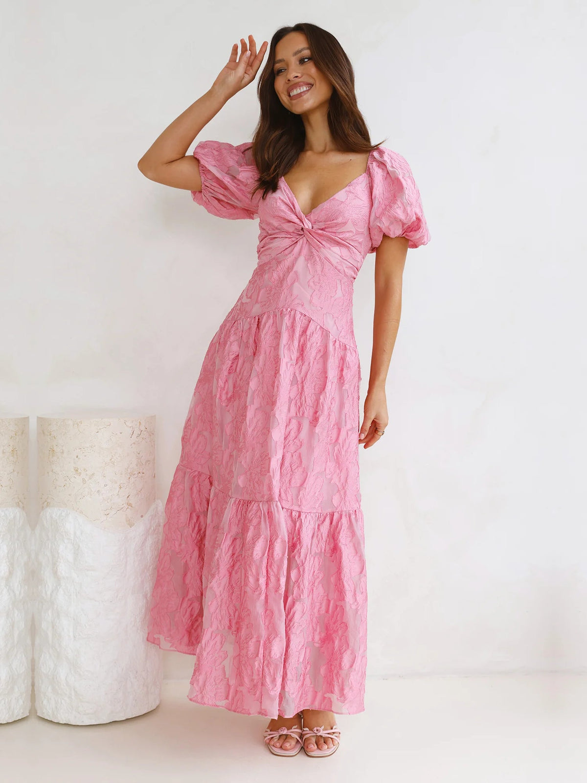 Pink V-neck tiered maxi dress with short puff sleeves and gathered waist