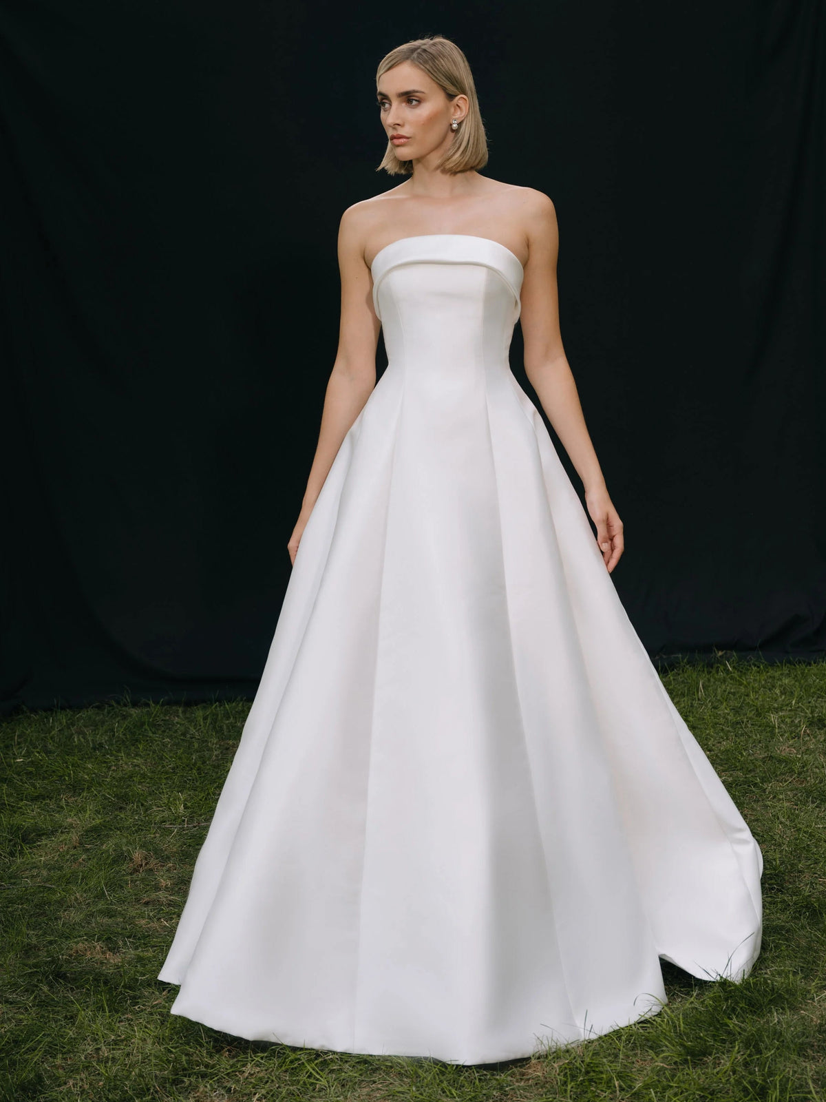Ivory strapless A-line wedding dress in satin, flowing full skirt, floor length