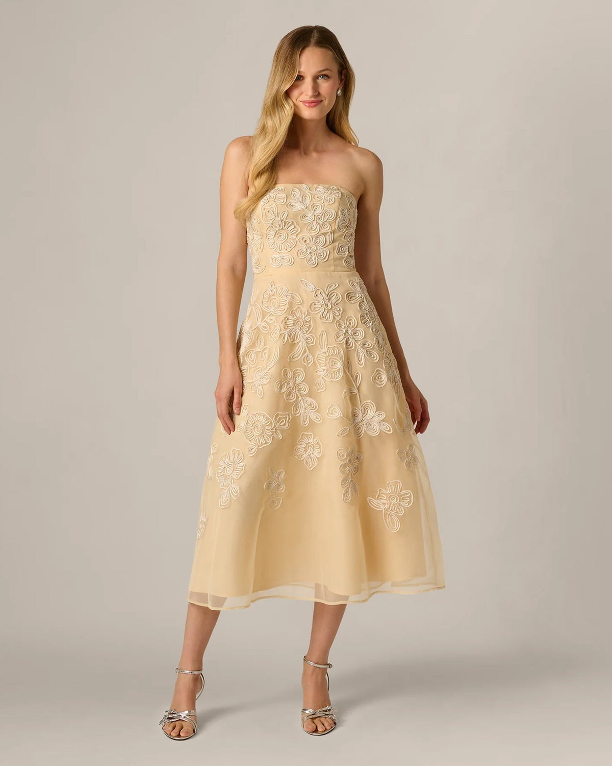 Pale yellow strapless A-line midi dress with floral embroidery, soft pleated skirt