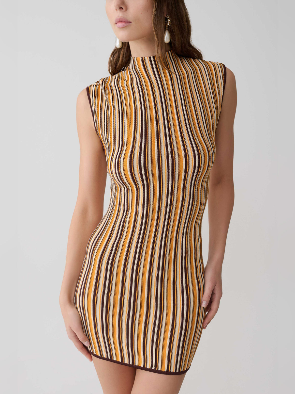 Sleeveless mini dress with vertical striped pattern, mock neck, brown cream and dark tones