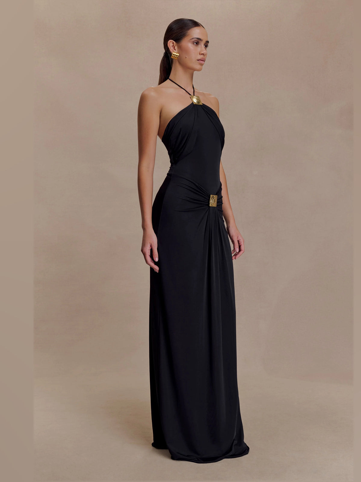 Black formal dress with structured woven fabric construction and maxi hem