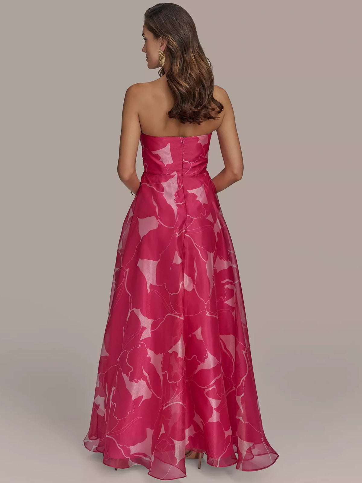 Back view of fuchsia strapless formal dress with abstract white print and ruched bodice