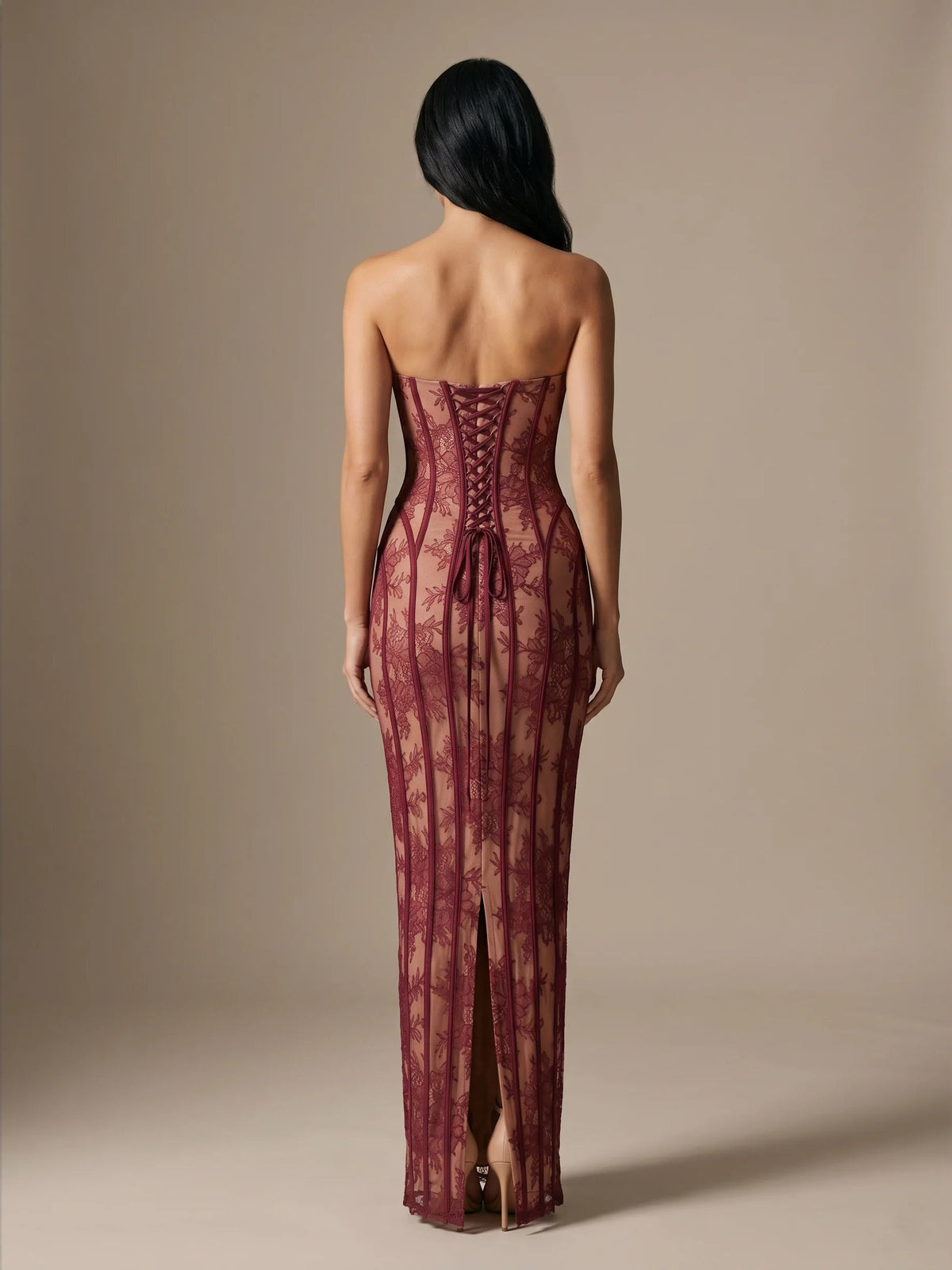 Burgundy open-back corset mermaid gown with sheer lace panels and front slit