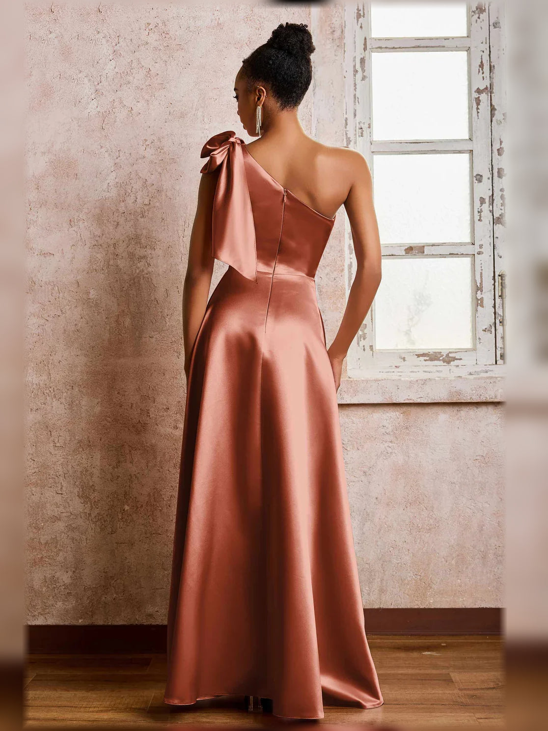Rust one-shoulder satin A-line formal dress with side slit and bow strap detail