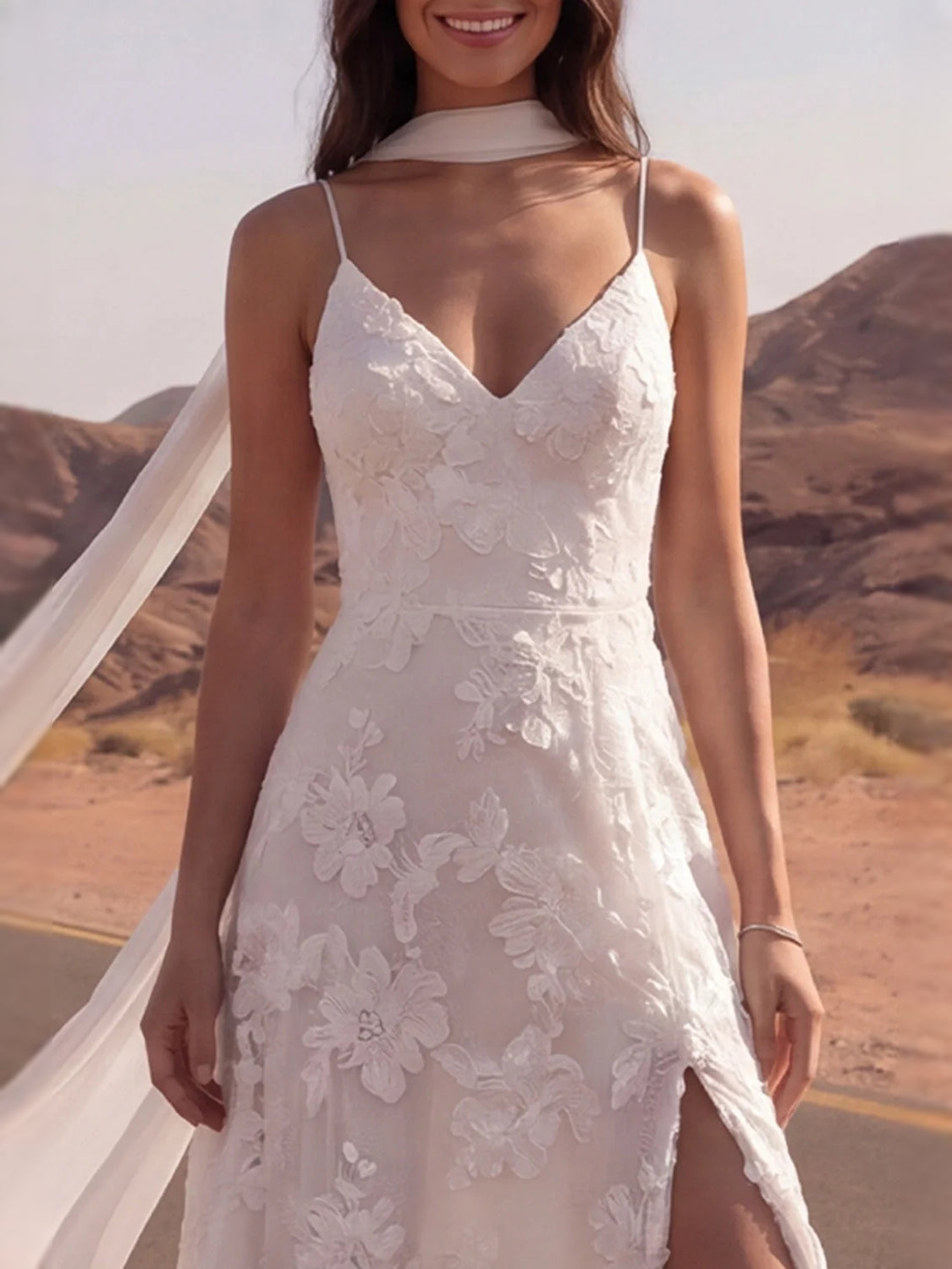 Ivory V-neck floral lace wedding dress with thin straps and front slit