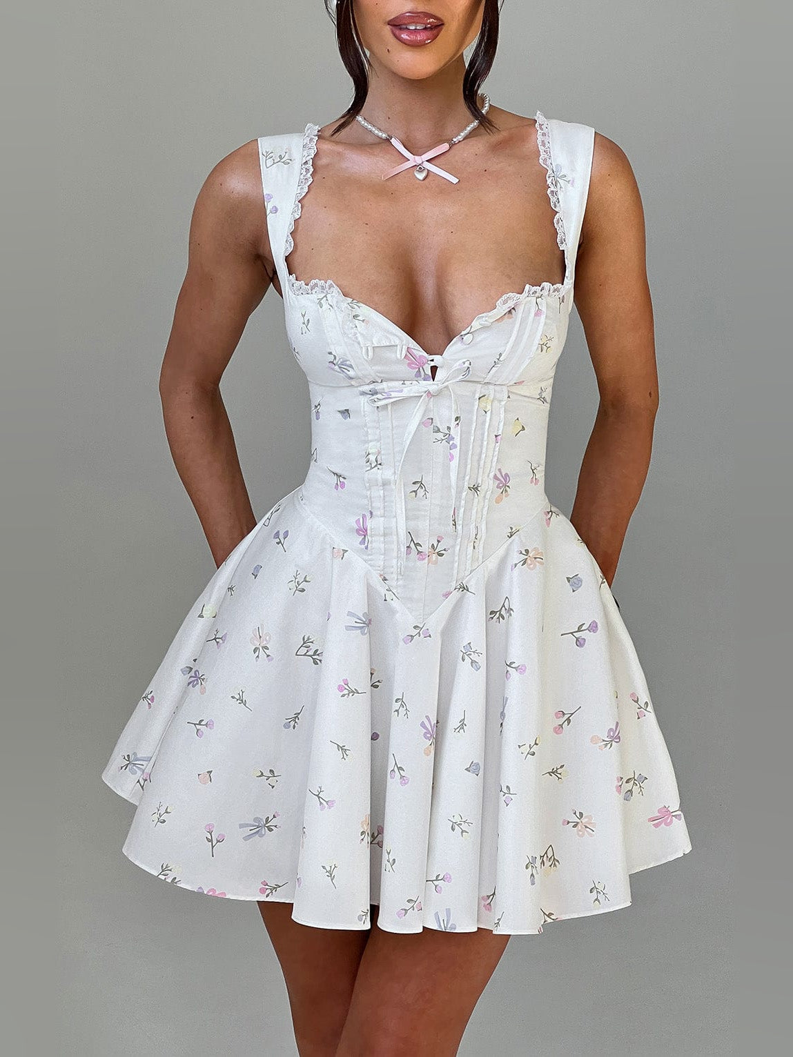 White floral mini homecoming dress with lace trim, sweetheart neckline, corset bodice