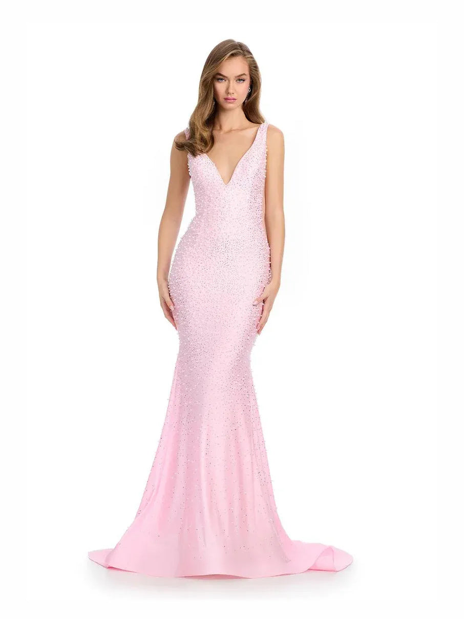 Pink beaded V-neck mermaid maxi prom dress, sleeveless, side view with hem flare