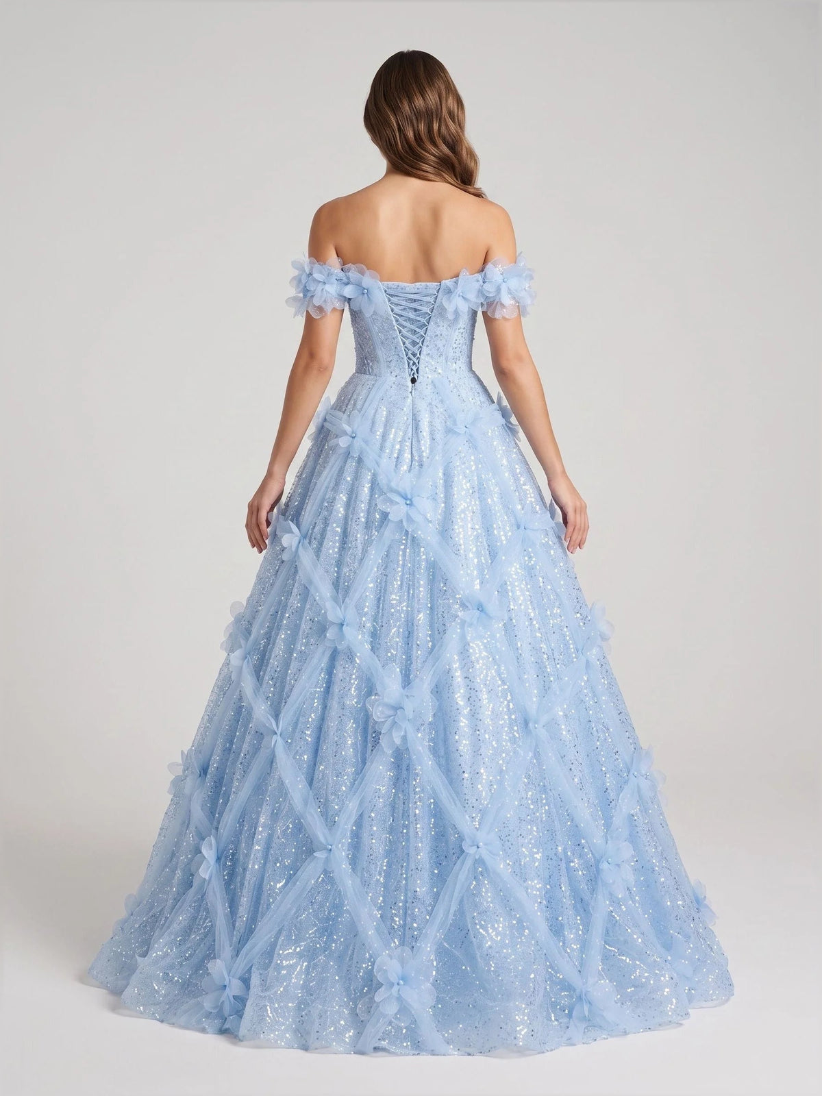Light blue corset ball gown with off-shoulder ruffle straps and glittered tulle back
