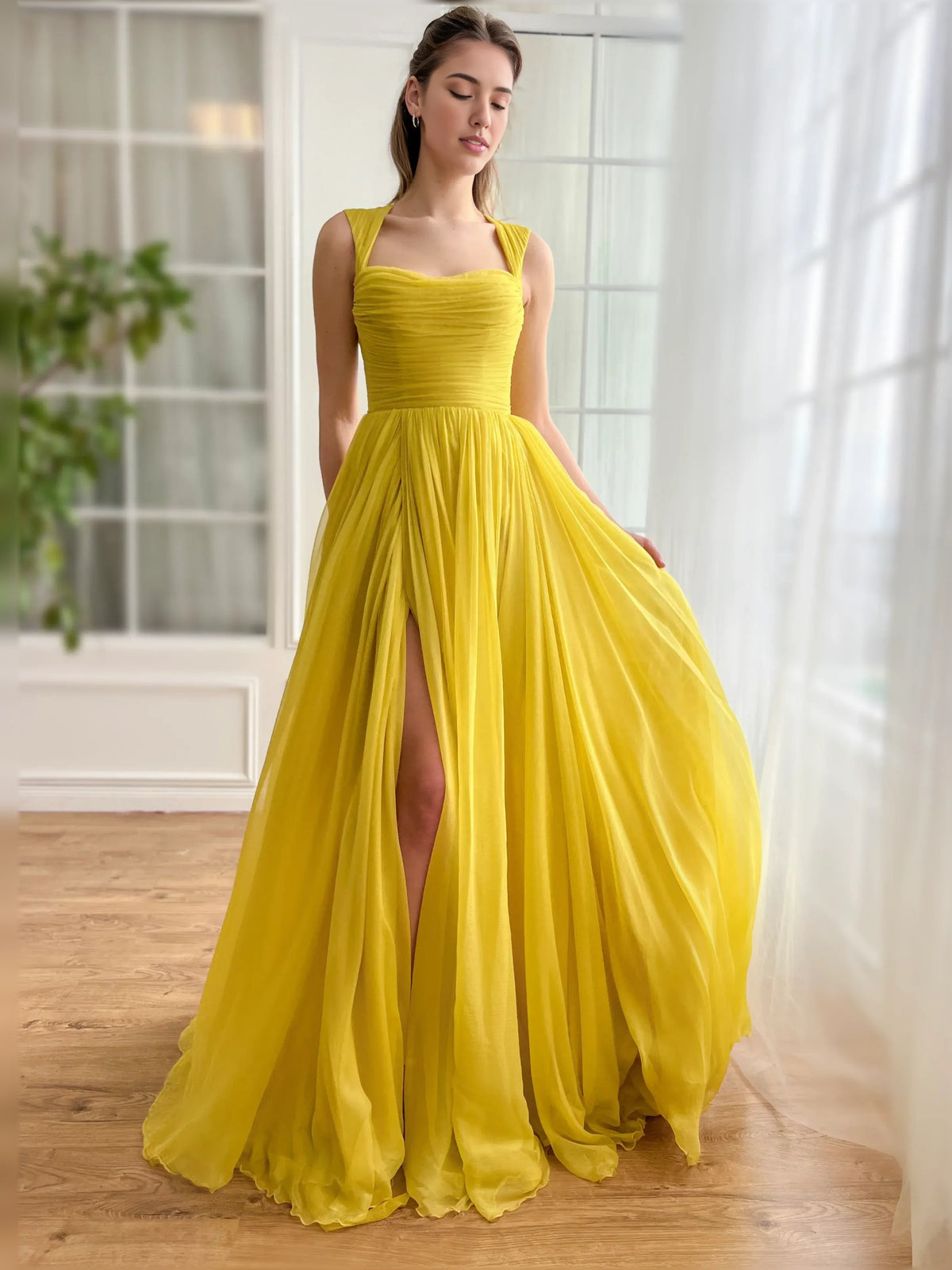 Yellow floor-length formal dress with sweetheart neckline, ruching, and front slit