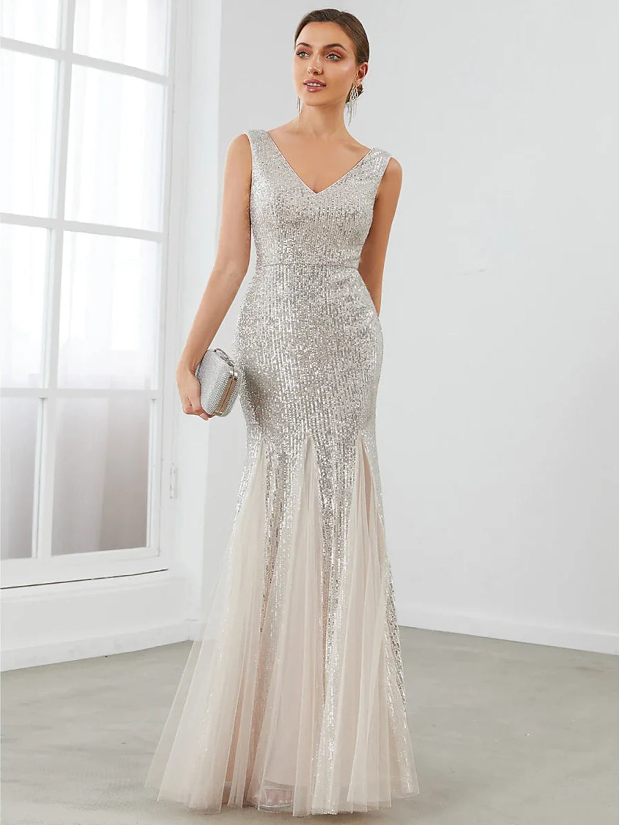 Silver sequin sleeveless formal gown with V-neck and fitted mermaid silhouette