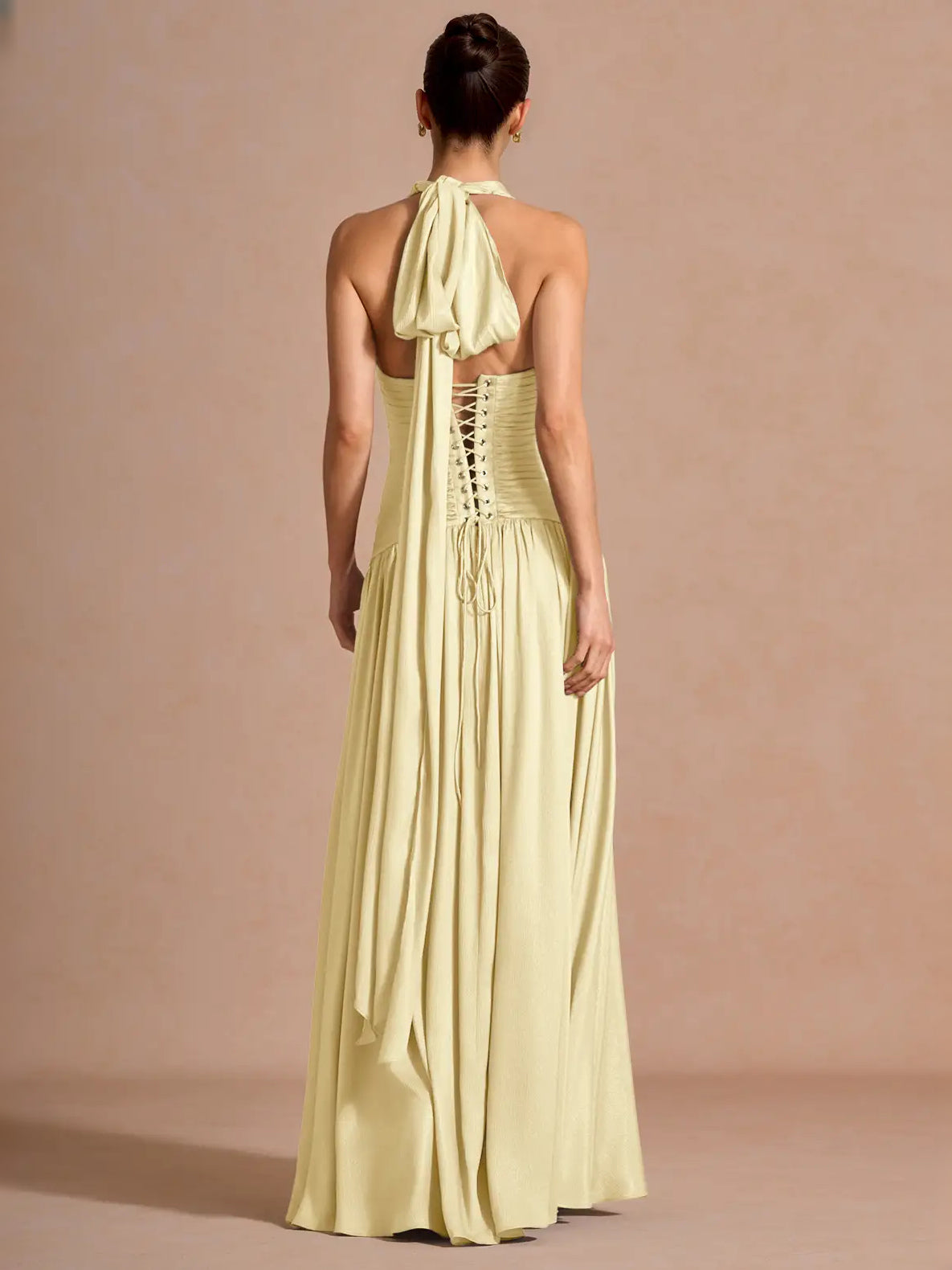 Pale lemon backless maxi prom dress with ruched corset bodice and flowing chiffon skirt