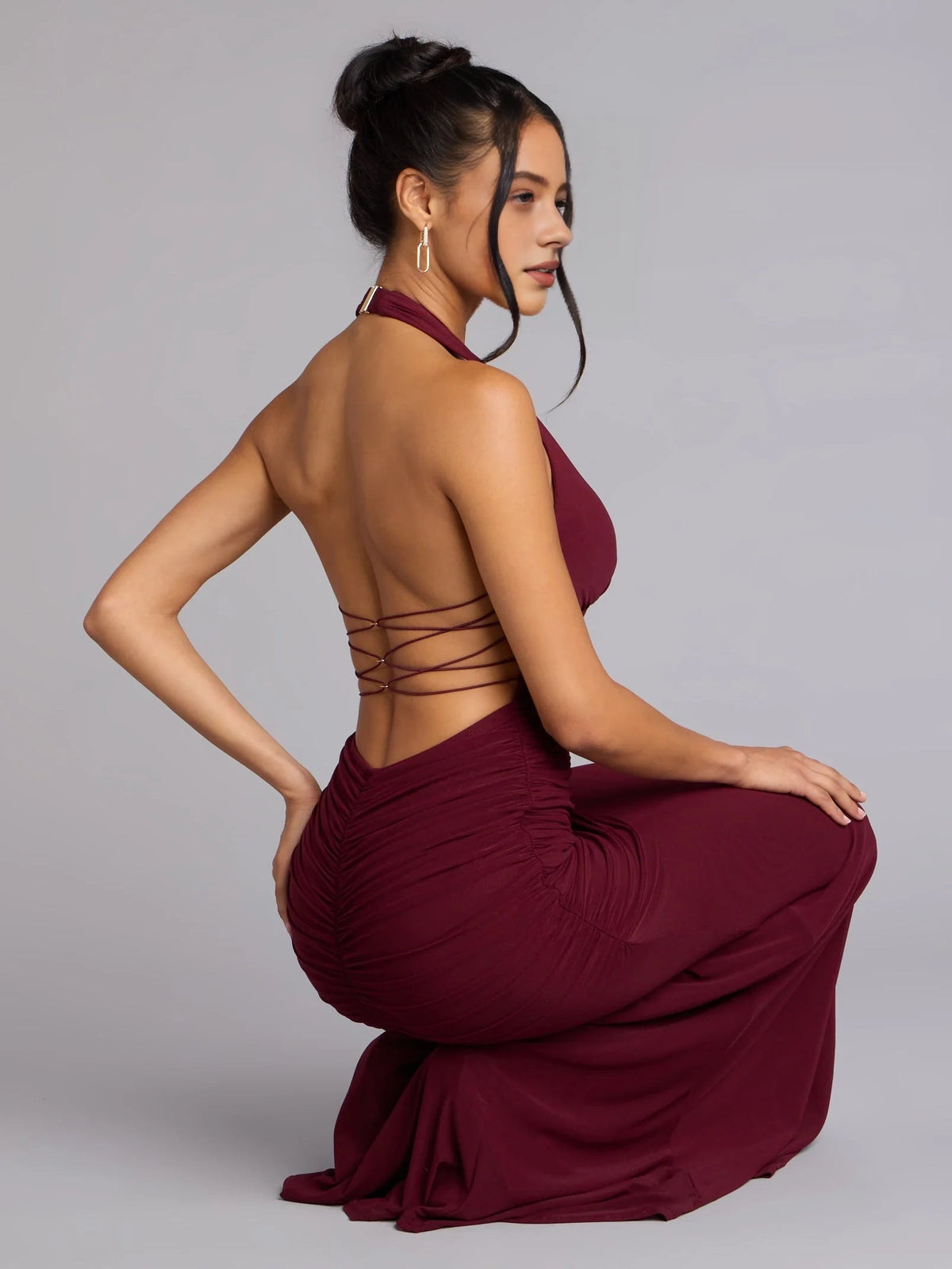 Deep red ruched corset mermaid dress, open back with crisscross straps and V-neck