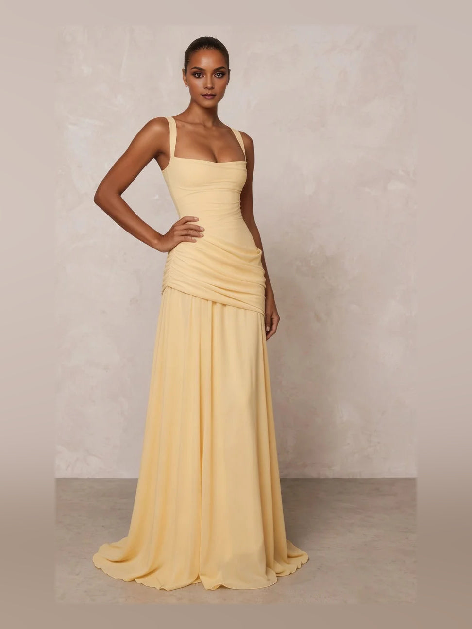 Pale lemon square-neck A-line prom dress with ruched bodice and flowing floor-length skirt