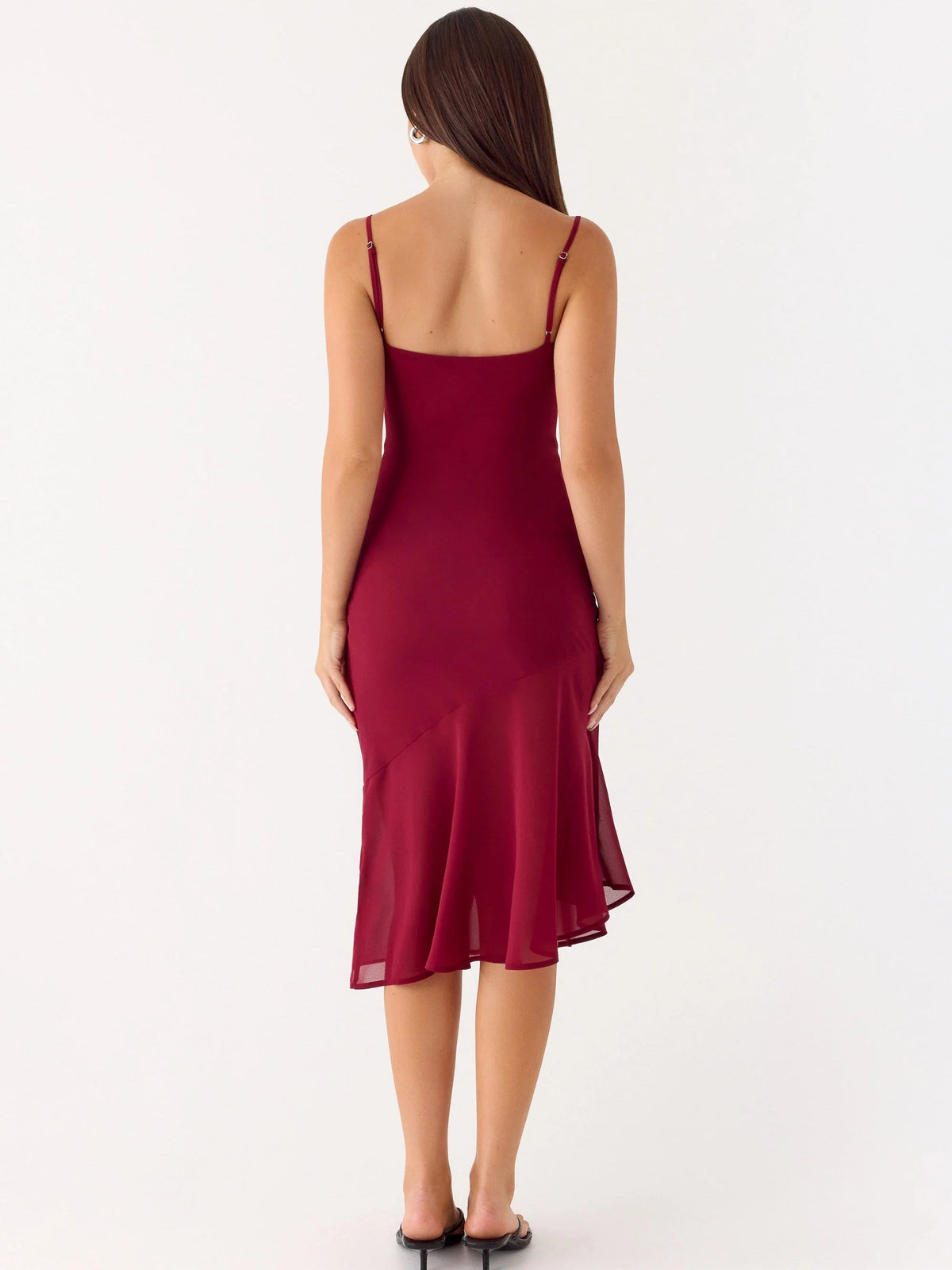 Back view of red midi formal dress with spaghetti straps and flared hem