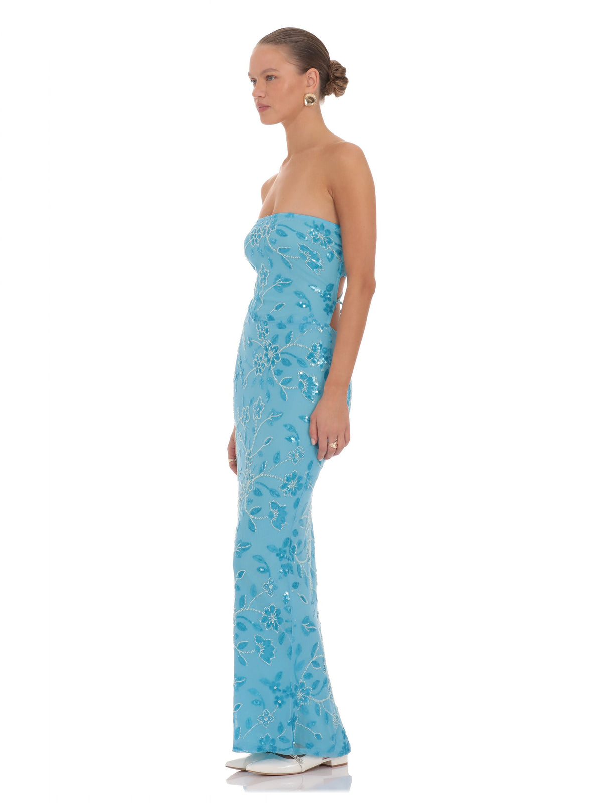 Blue bridesmaid dress with structured woven fabric construction and maxi hem