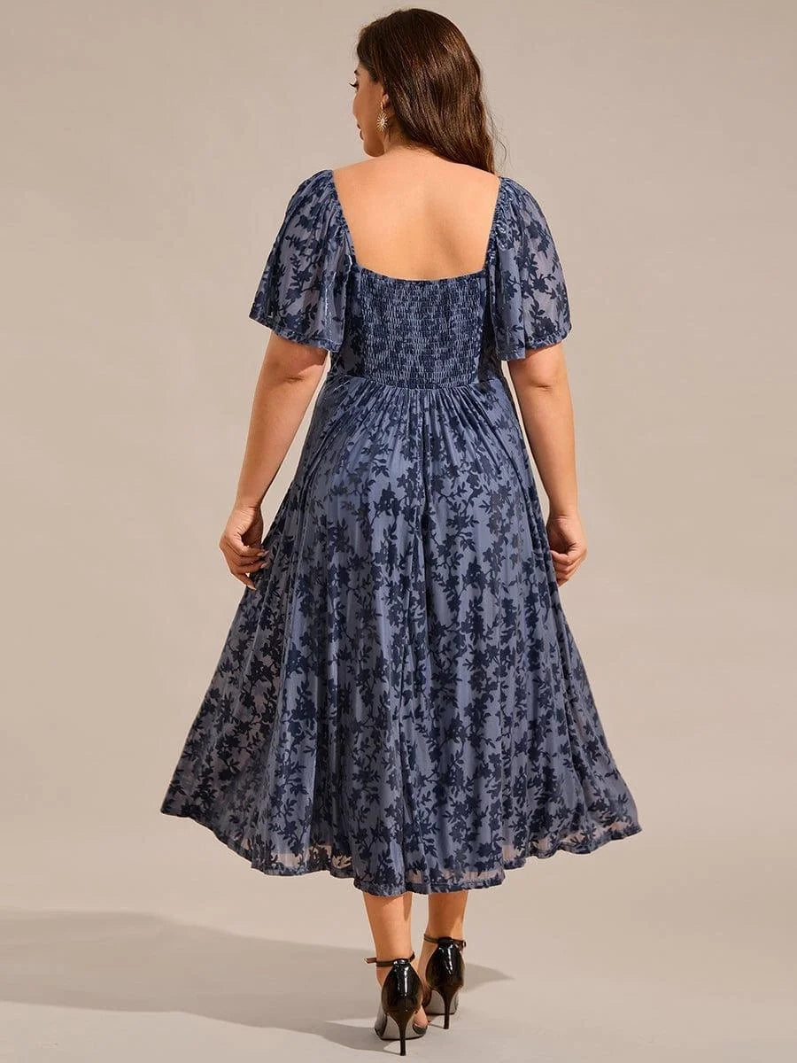 Navy blue A-line midi dress back view with gathered waist and puff sleeves