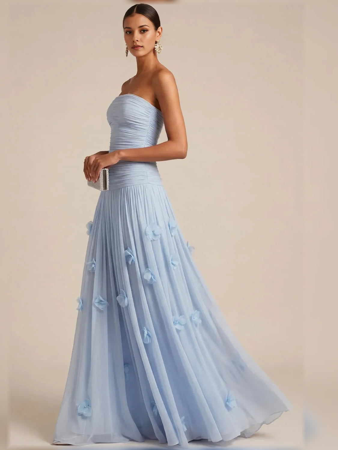 Light blue strapless floor-length dress with ruched bodice and layered skirt appliques