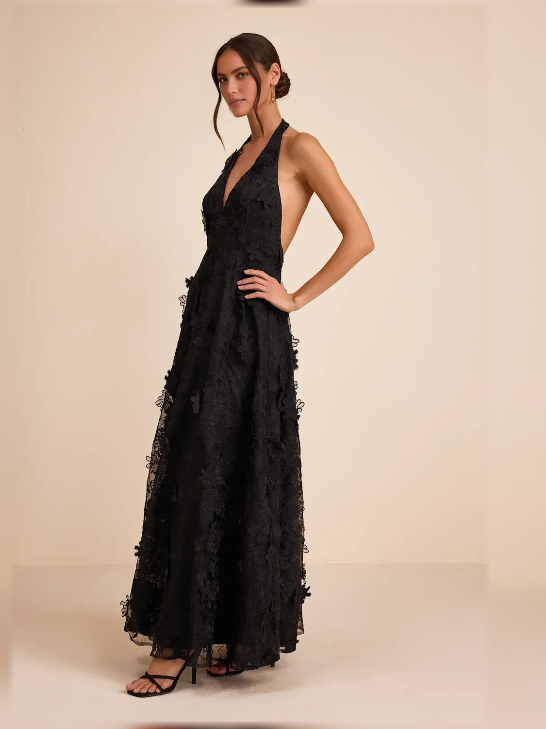 Black halter neck maxi formal dress with floral lace appliques and ruffled skirt edges
