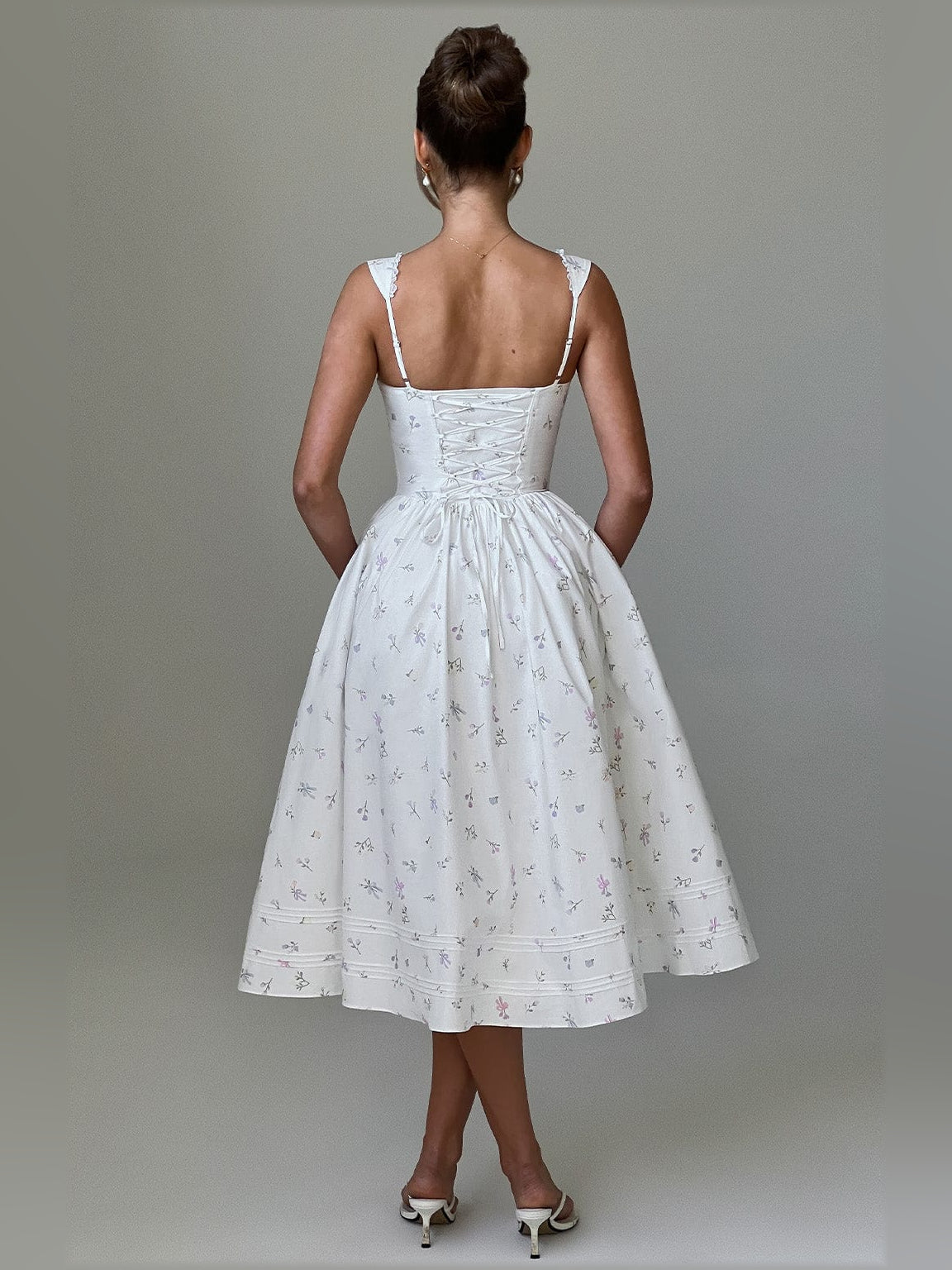 White midi formal dress, open back with lace-trim straps, gathered full skirt, allover print