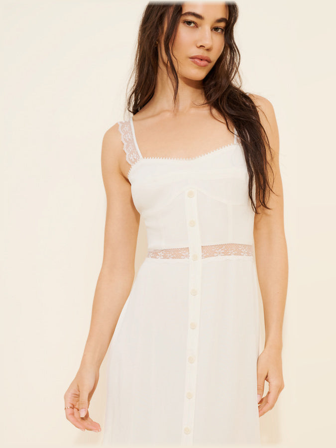 White midi dress with scalloped lace neckline, fitted bodice and buttoned front