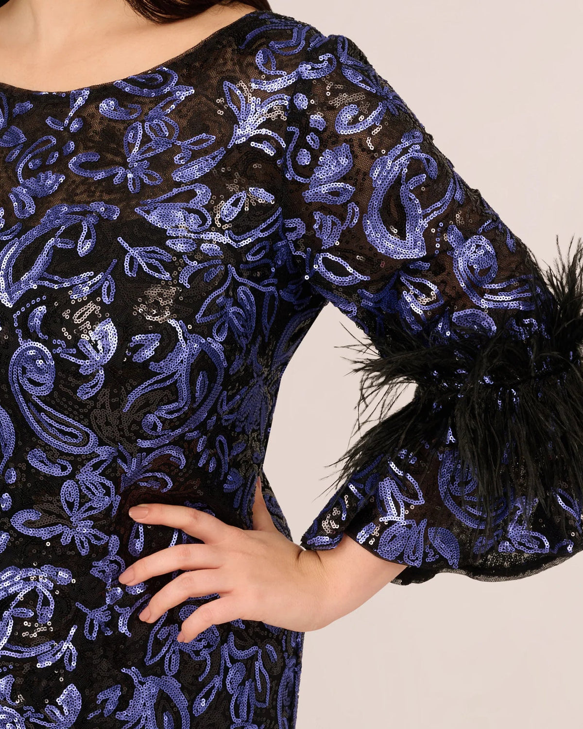 Close-up of navy blue sequin-embellished neckline and embroidered pattern on maxi dress