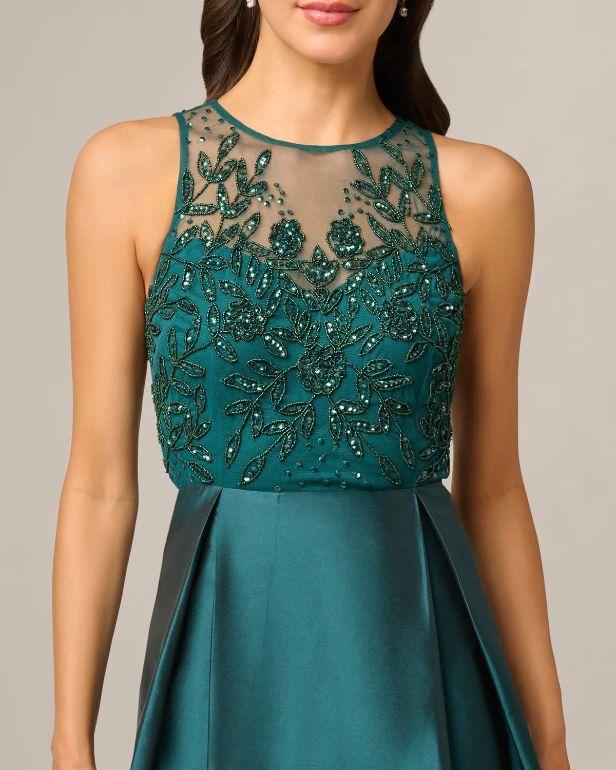 Teal green sleeveless beaded illusion bodice with floral beadwork detail