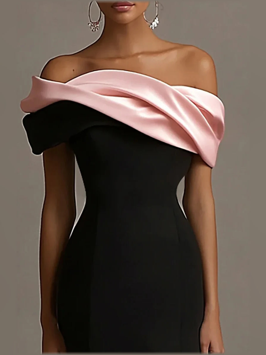 Black corset bodice off-shoulder gown with pink satin drape and long skirt