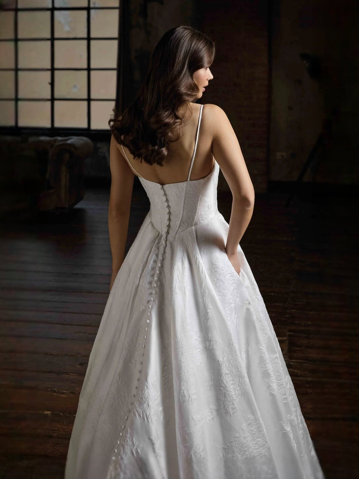Ivory satin ball-gown wedding dress, corset back detail and thin straps, full skirt