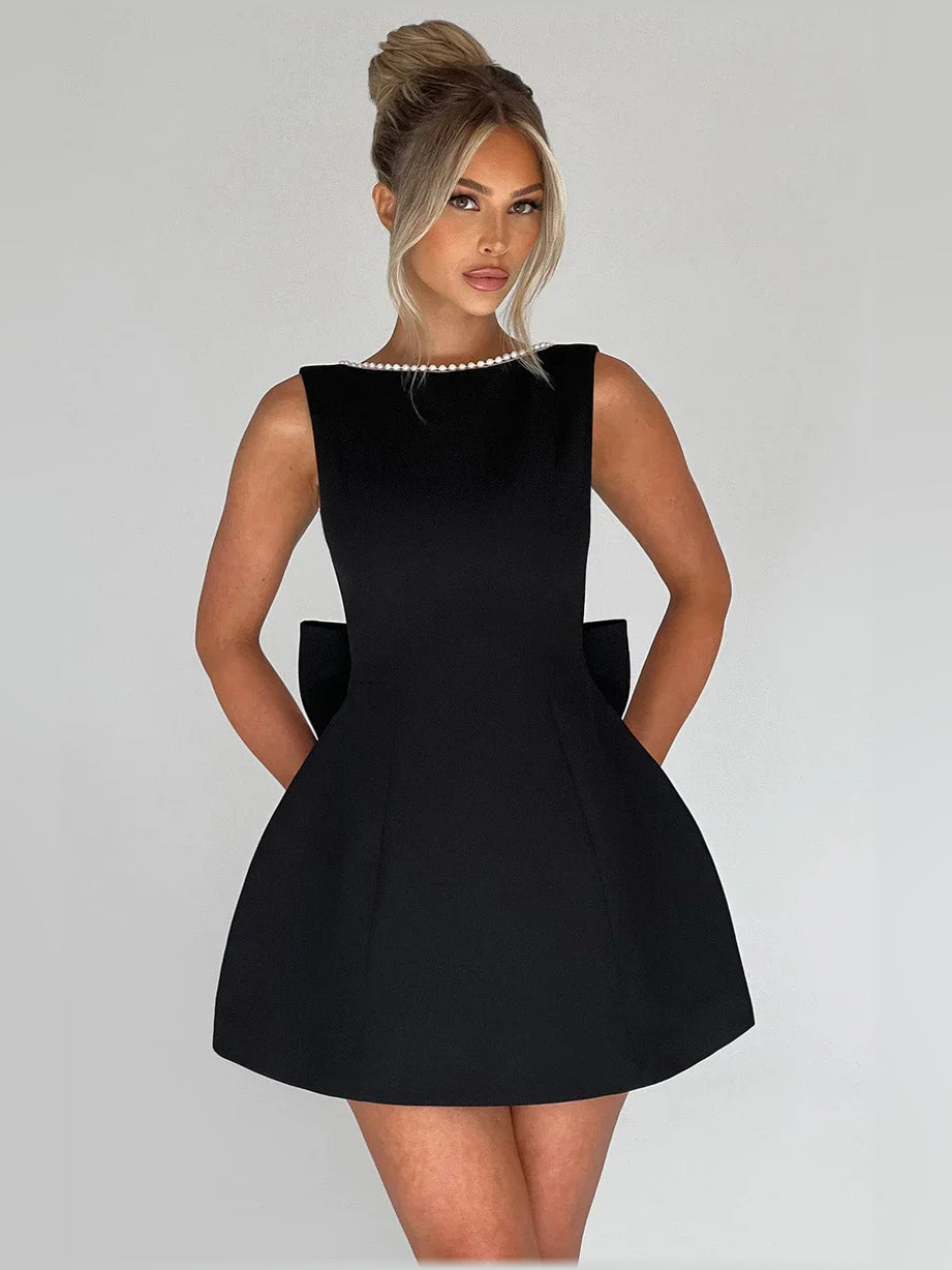 Black sleeveless mini formal dress with beaded high neckline and A-line skirt